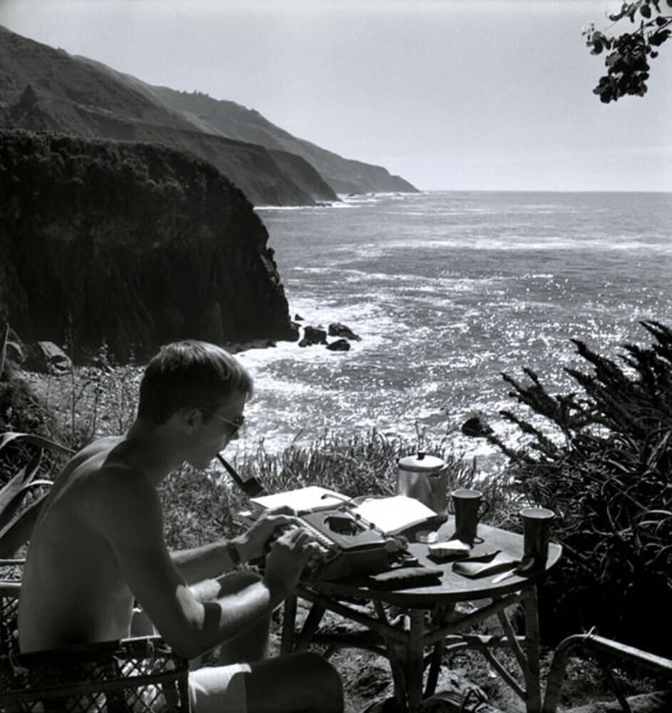 Hunter S. Thompson typing on the beach