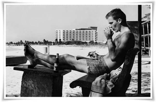 Hunter S. Thompson writing on the beach in Puerto Rico